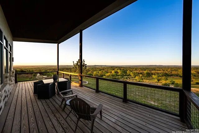 a view of a balcony with wooden floor