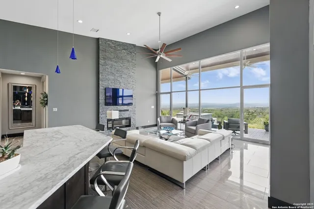 a living room with furniture and a large window