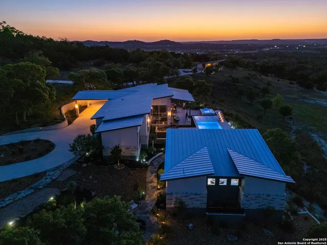 a view of house with outdoor space and garden