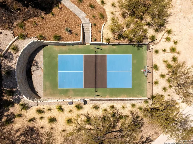 a view of a garden and swimming pool