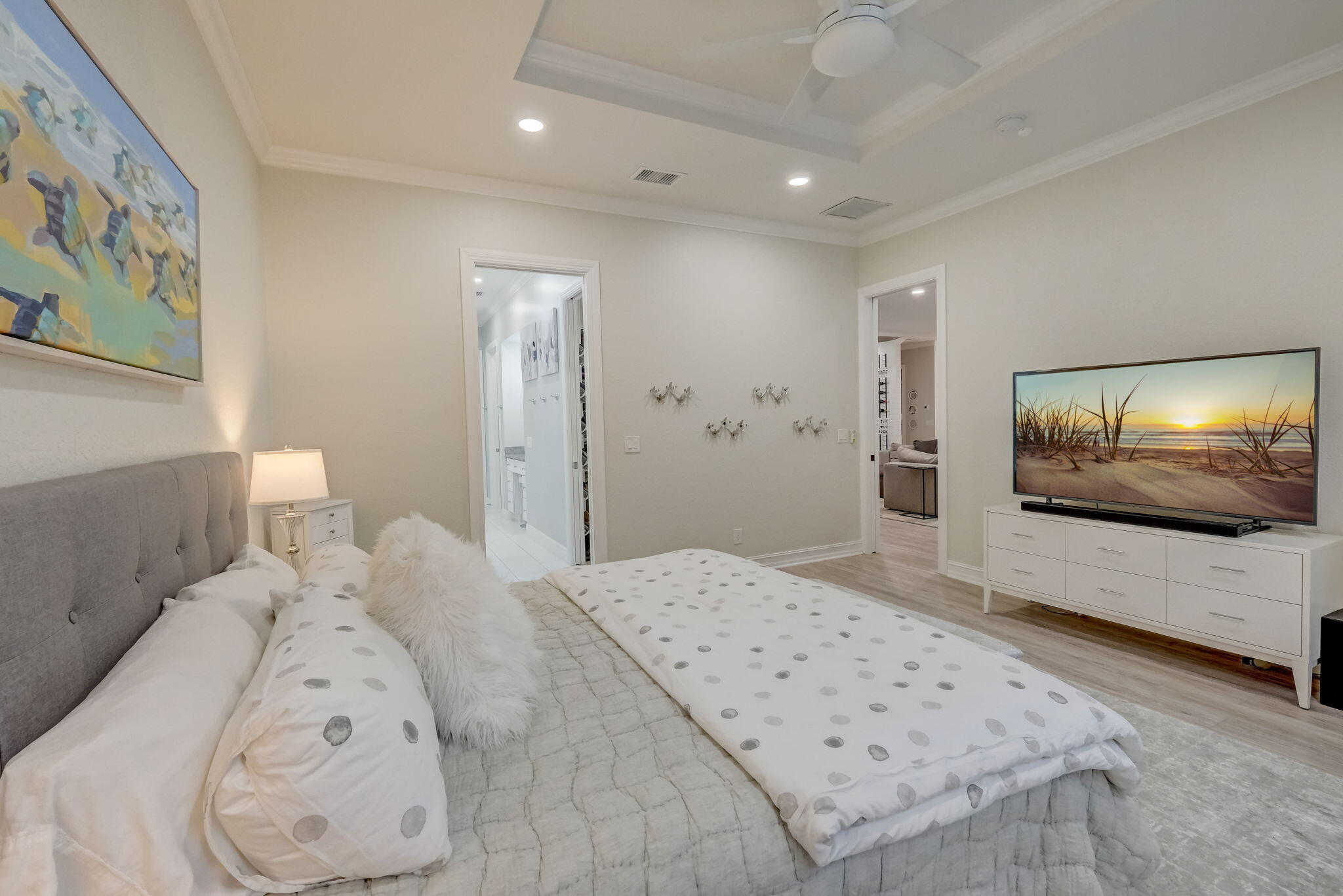 19199 Southeast Daniel Lane Jupiter, FL 33469 - Photo 16 of 49 a bedroom with a bed and a flat screen tv