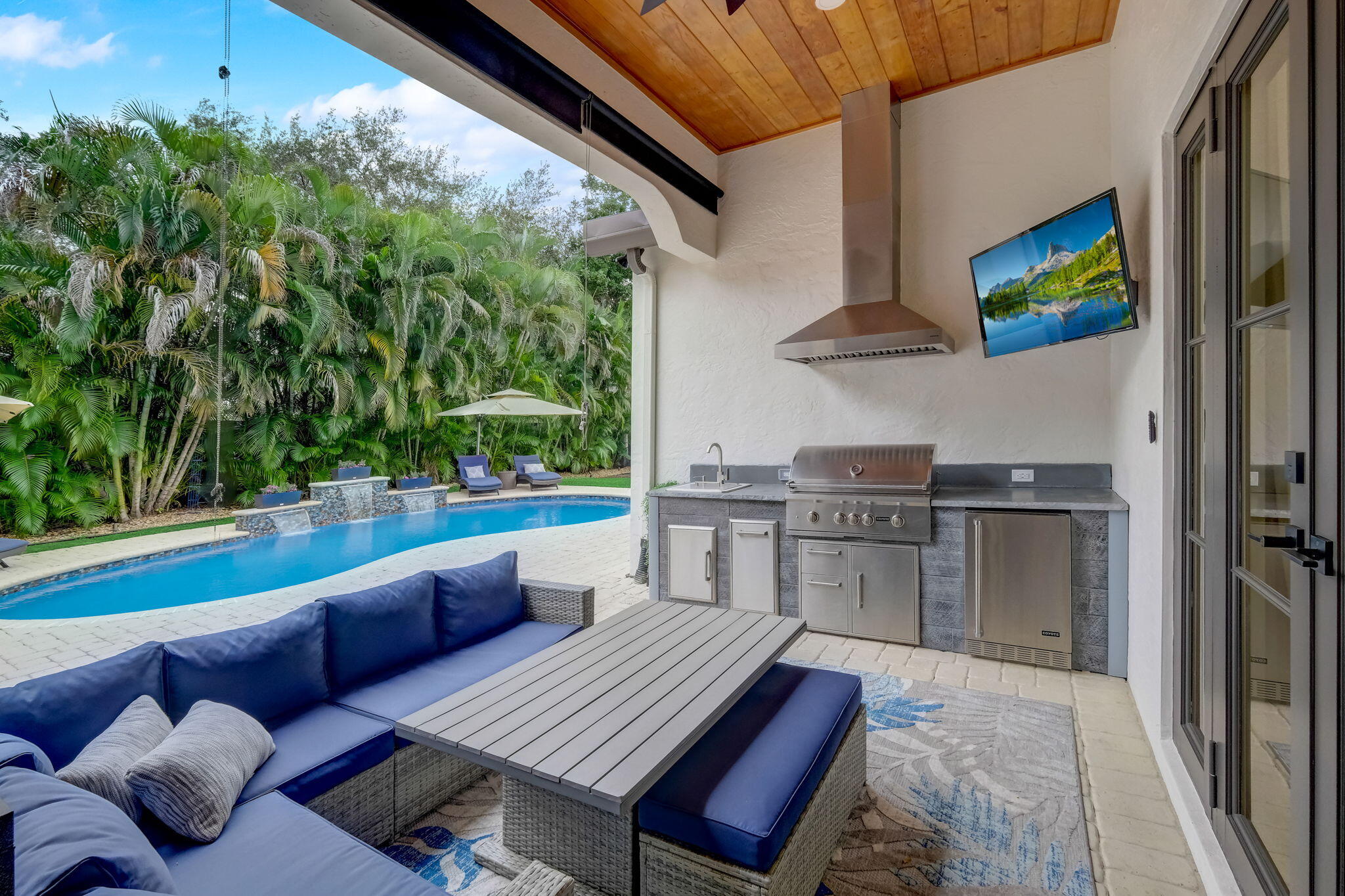 19199 Southeast Daniel Lane Jupiter, FL 33469 - Photo 29 of 49 a balcony with furniture and a floor to ceiling window