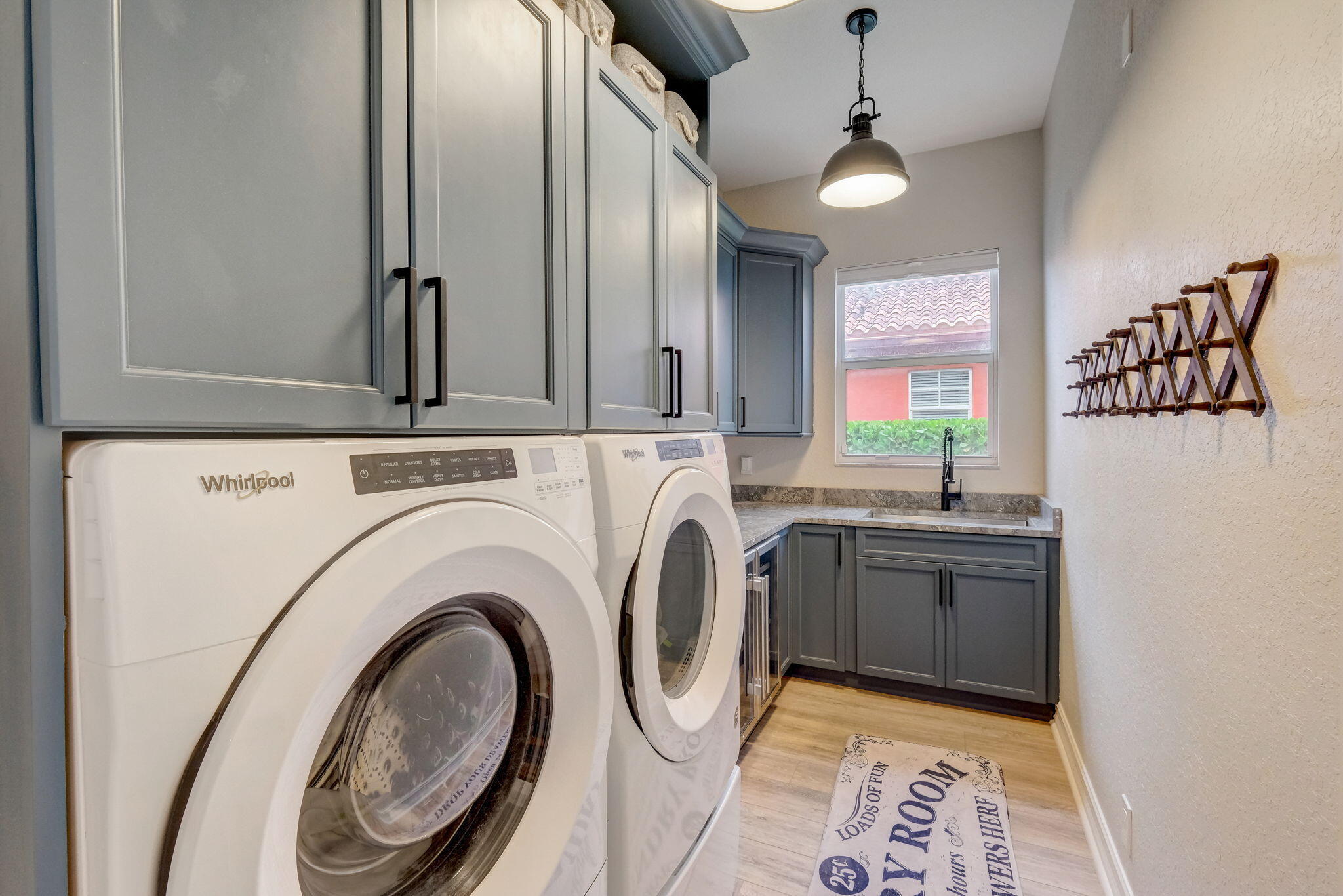19199 Southeast Daniel Lane Jupiter, FL 33469 - Photo 30 of 49 a view of a kitchen with washer and dryer