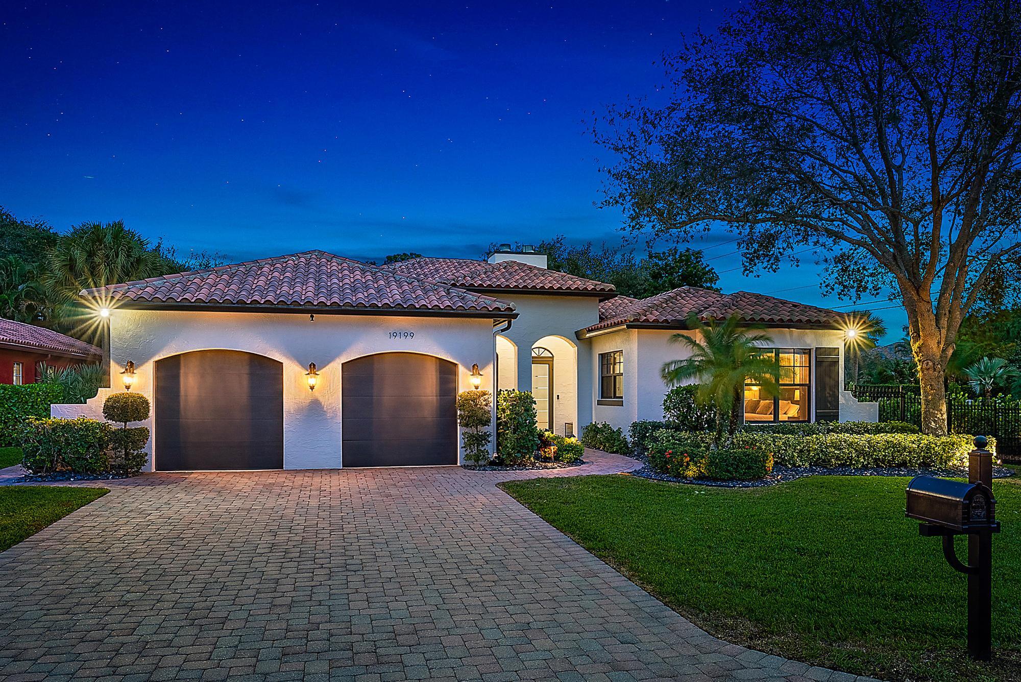 19199 Southeast Daniel Lane Jupiter, FL 33469 - Photo 44 of 49 a front view of a house with a garden