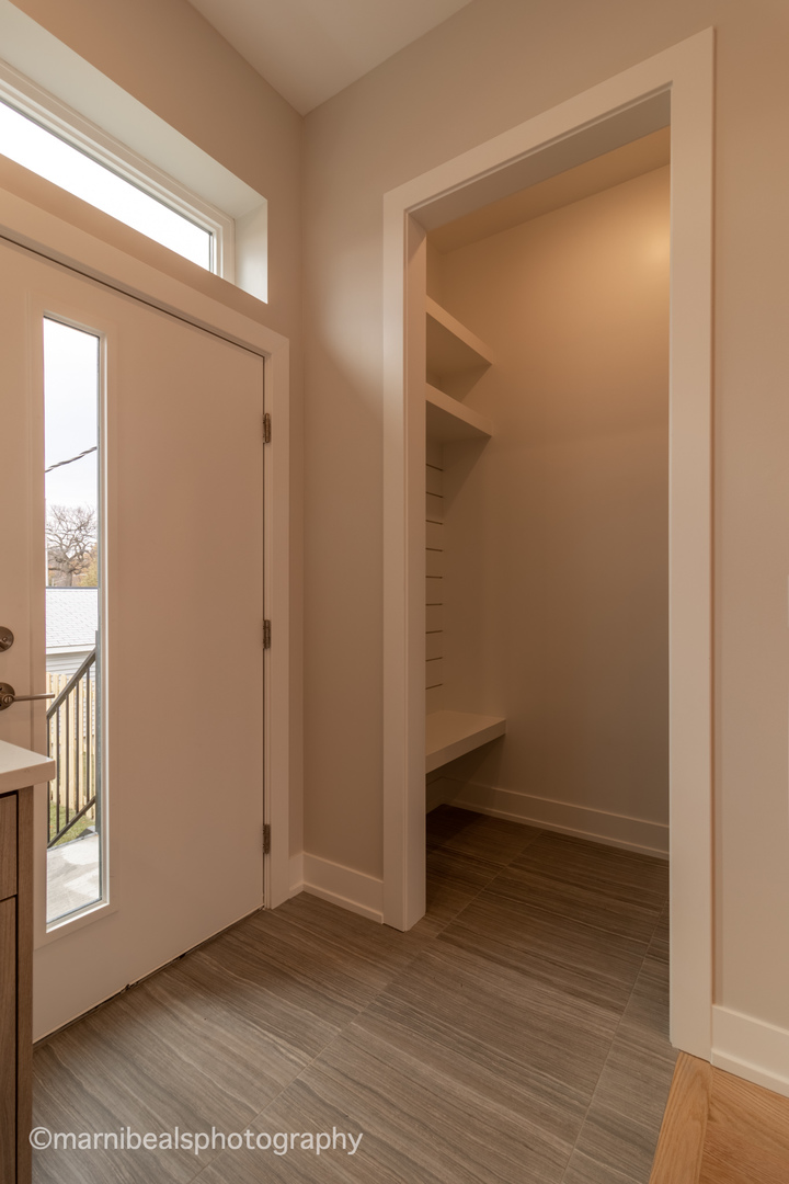 1349 East Marquette Road Chicago, IL 60637 - Photo 9 of 26 a view of an empty room with wooden floor and a window