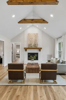 a large kitchen with a table and chairs in it