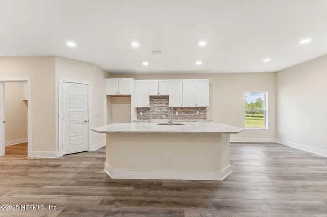 a view of kitchen with wooden floor