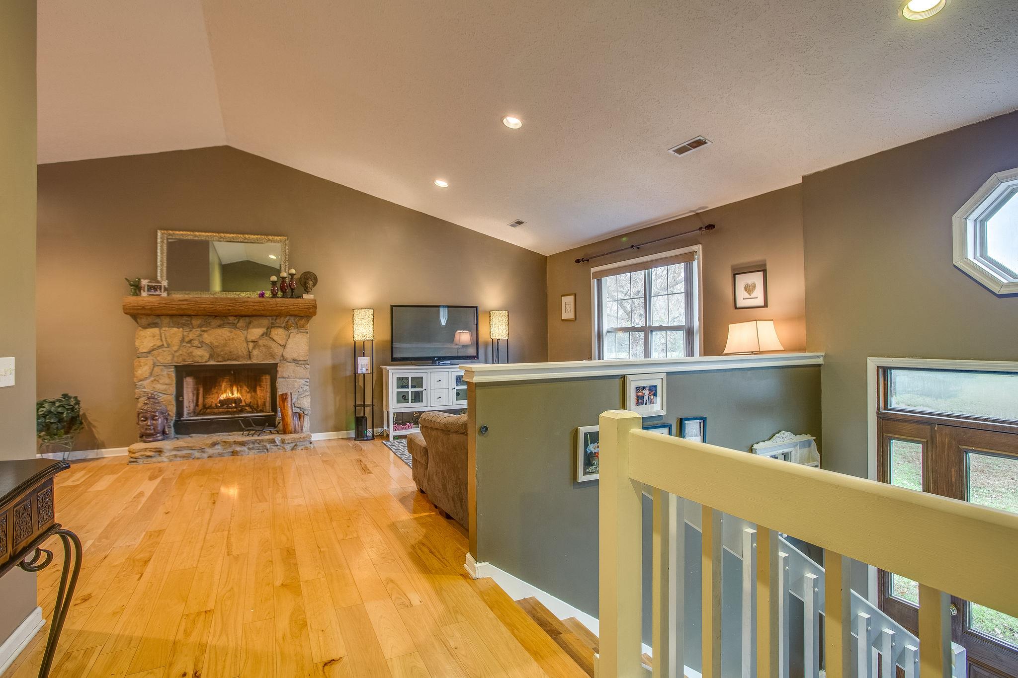 2133 Lee Road Spring Hill, TN 37174 - Photo 3 of 30 a bed room with a bed and a fireplace