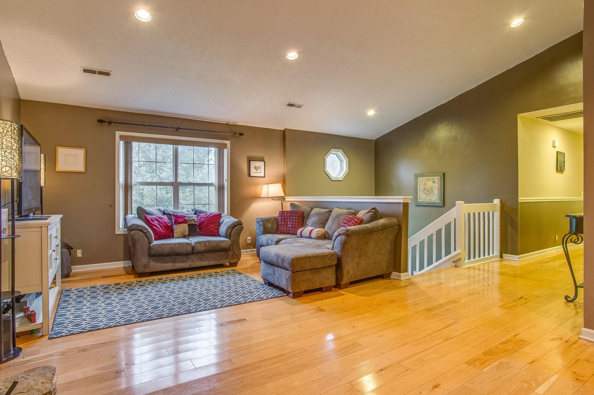 2133 Lee Road Spring Hill, TN 37174 - Photo 29 of 30 a living room with furniture and a flat screen tv