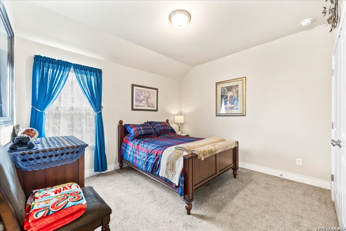 3034 Agar Bulverde, TX 78163 - Photo 25 of 33 a bedroom with a bed and a couch