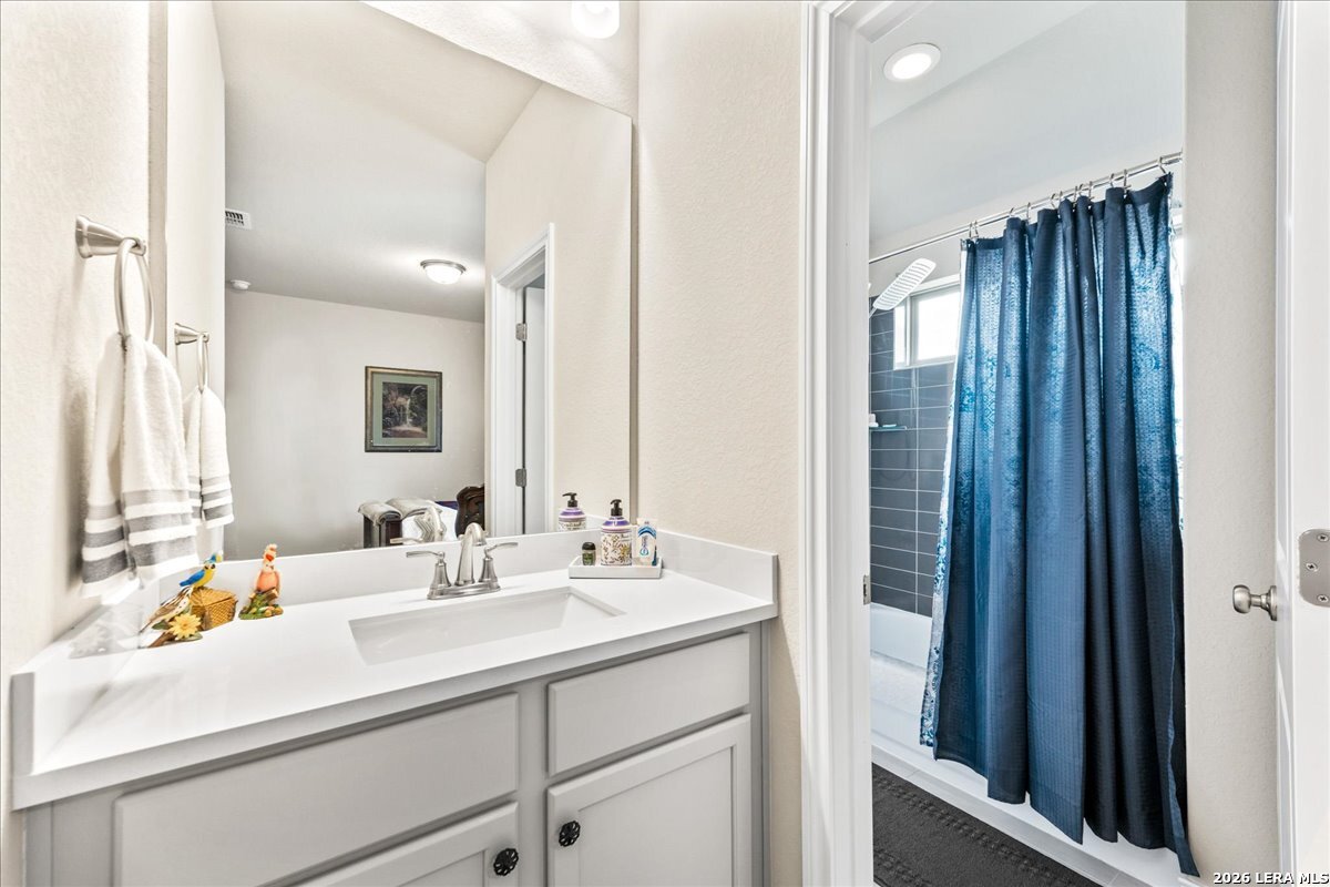 3034 Agar Bulverde, TX 78163 - Photo 26 of 33 a bathroom with a sink double vanity and a mirror