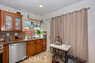 a kitchen with a table chairs and cabinets