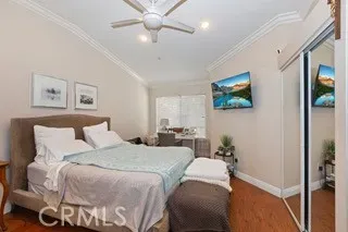 a bedroom with a bed and a chandelier