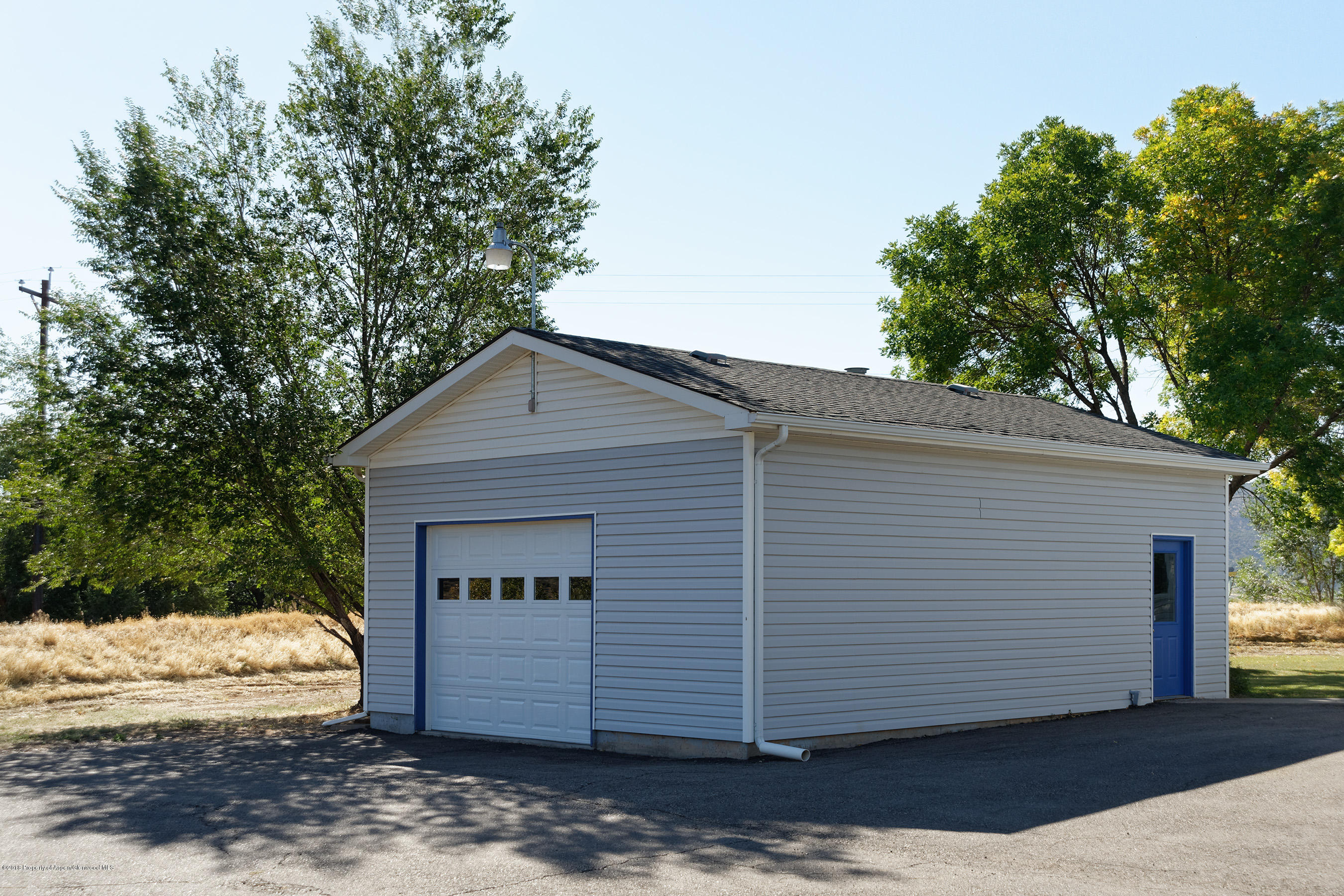 1359 County Road 294 Rifle, CO 81650 - Photo 23 of 31 a front view of a house with a yard