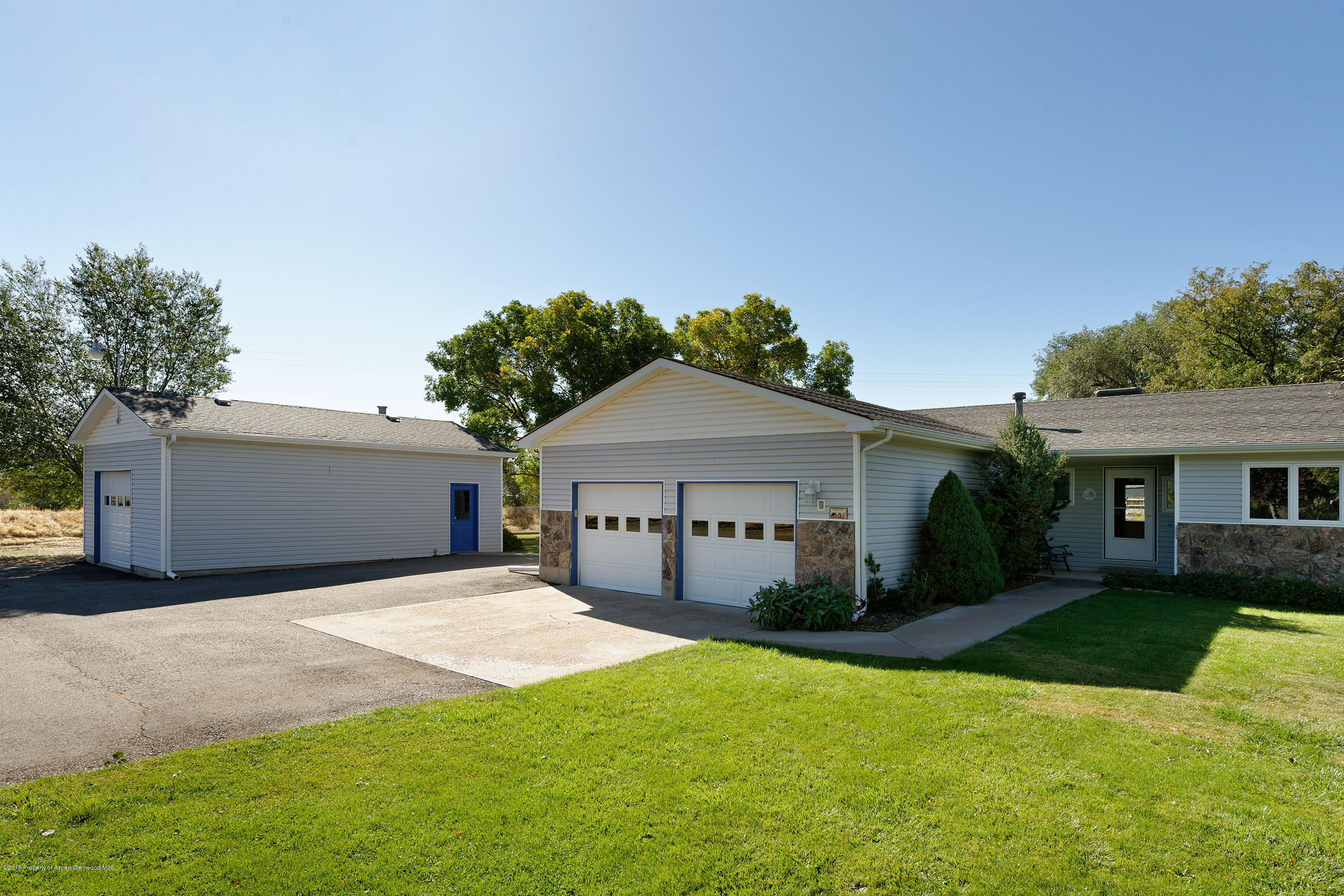 1359 County Road 294 Rifle, CO 81650 - Photo 3 of 31 a front view of house with yard and green space