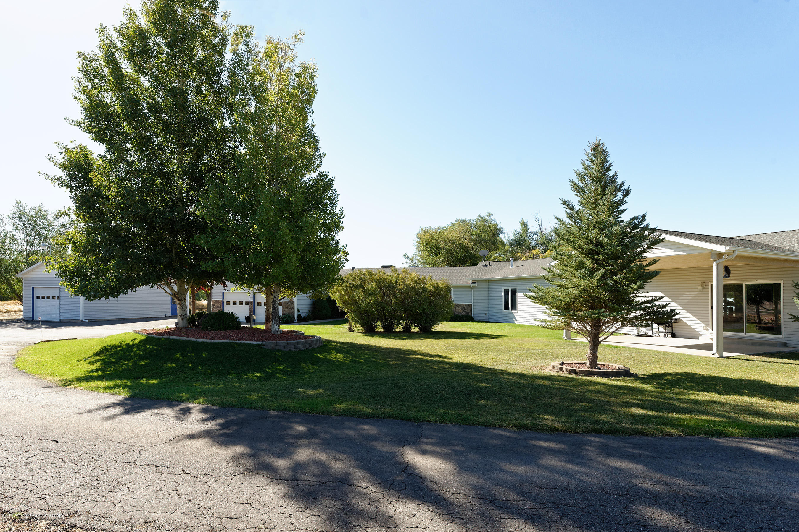 1359 County Road 294 Rifle, CO 81650 - Photo 4 of 31 a view of a house with garden and trees