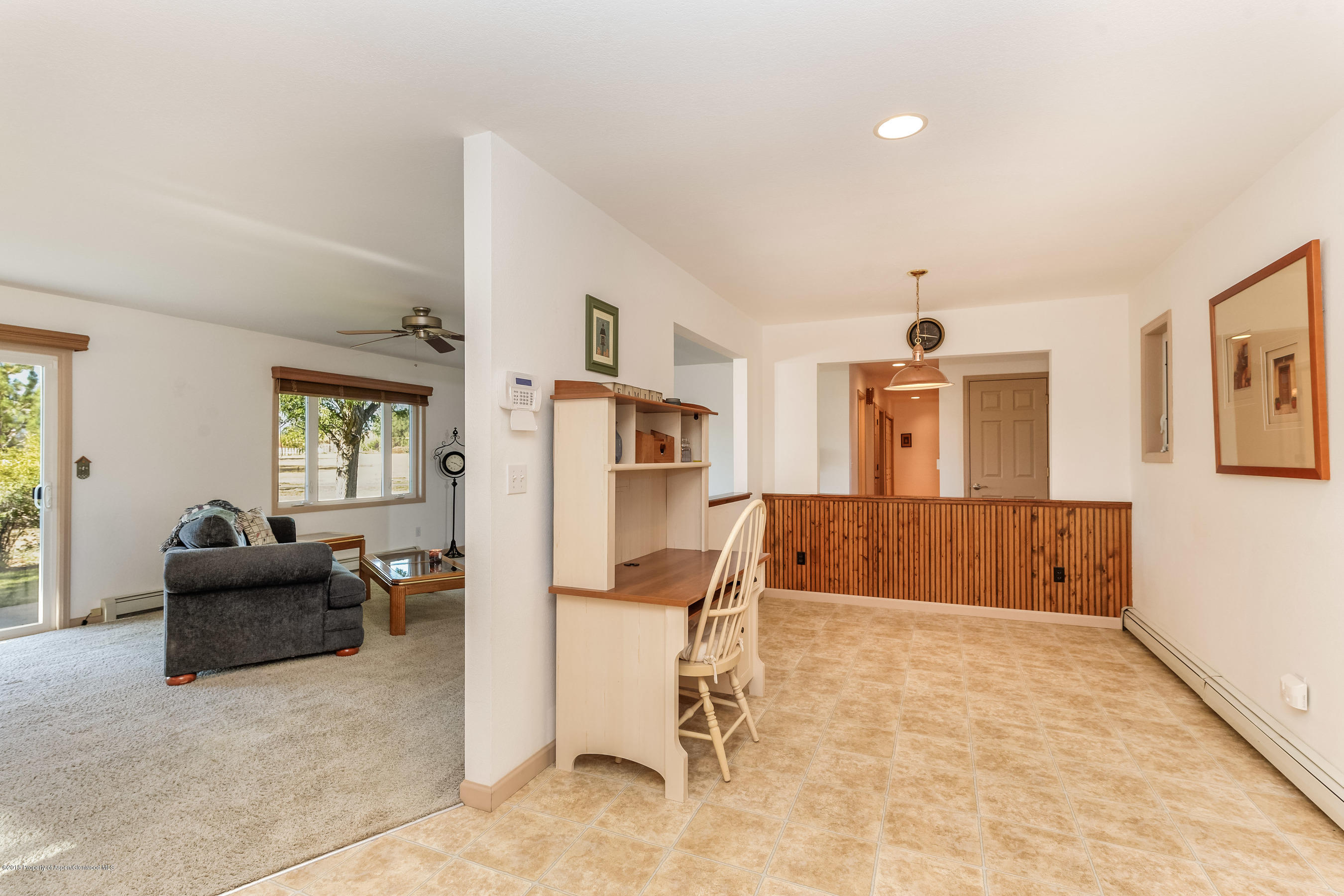 1359 County Road 294 Rifle, CO 81650 - Photo 6 of 31 a living room with furniture and a refrigerator