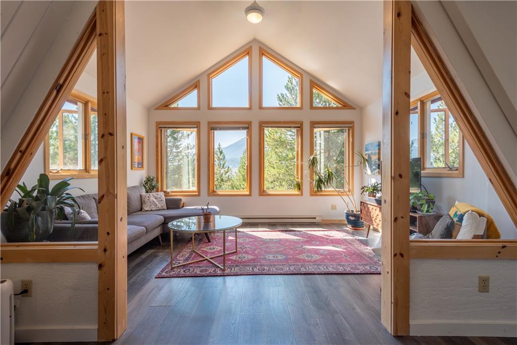 96 L Road Silverthorne, CO 80498 - Photo 1 of 35 a living room with furniture and a large window