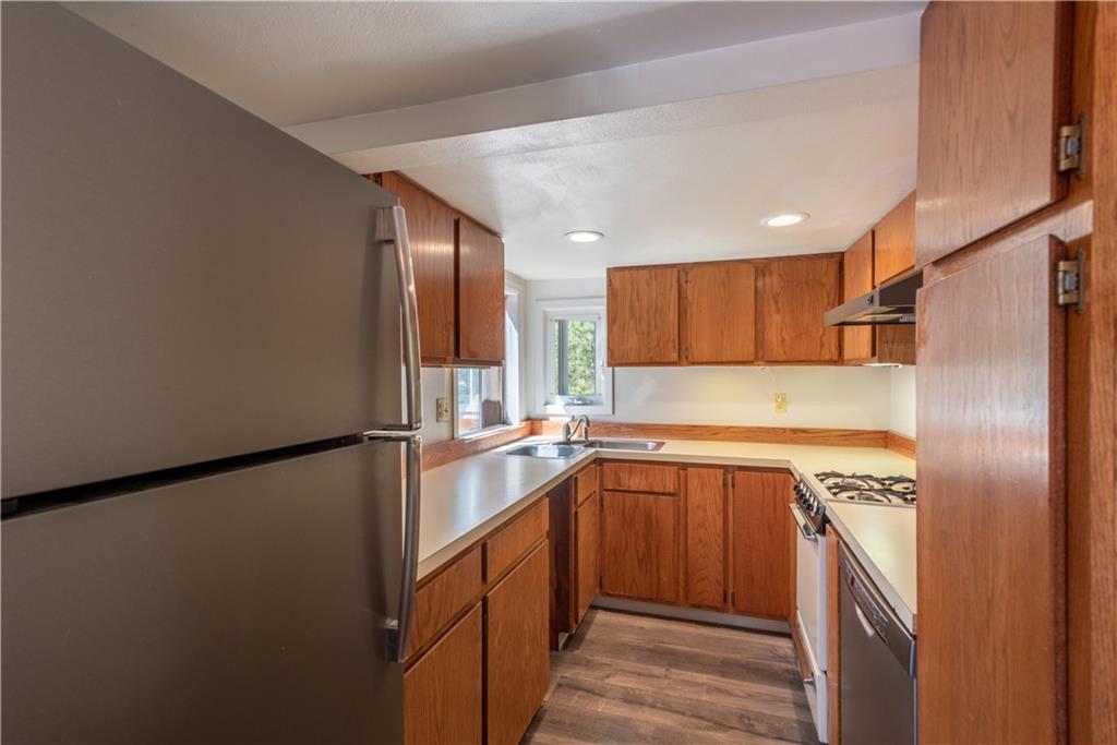 96 L Road Silverthorne, CO 80498 - Photo 11 of 35 a kitchen with a sink a refrigerator and cabinets