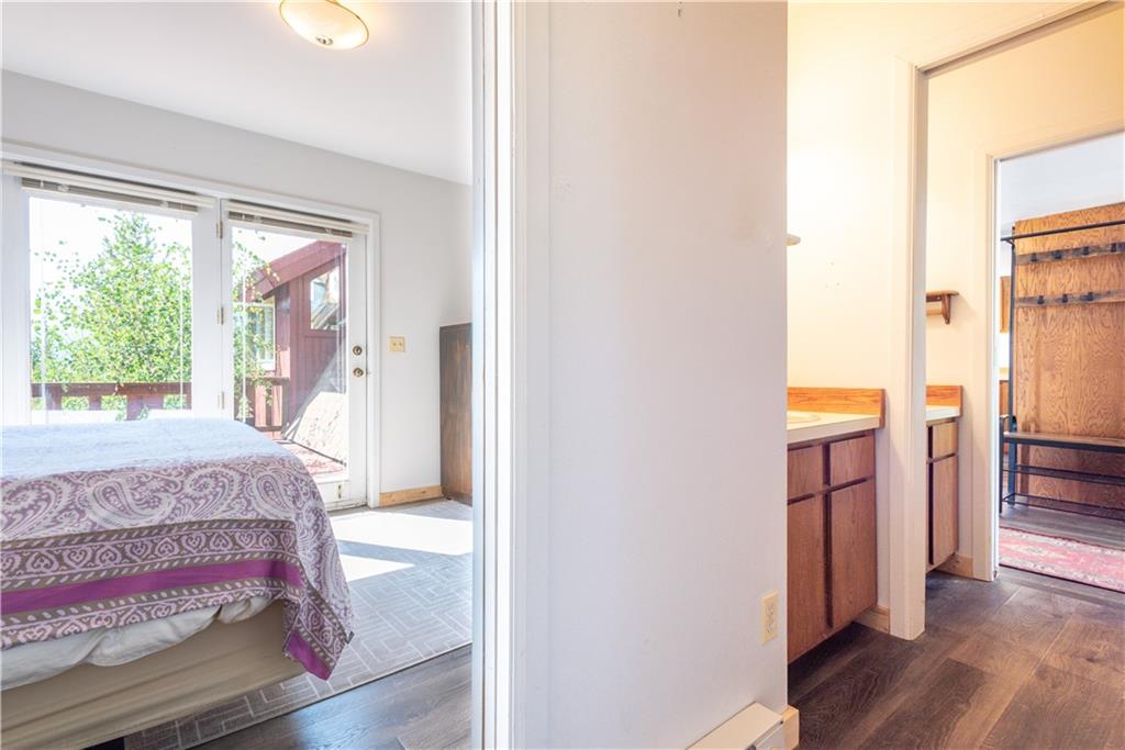 96 L Road Silverthorne, CO 80498 - Photo 13 of 35 a bedroom with a bed and a large window