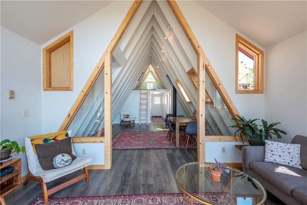 96 L Road Silverthorne, CO 80498 - Photo 30 of 35 a living room with wooden floor and a potted plant