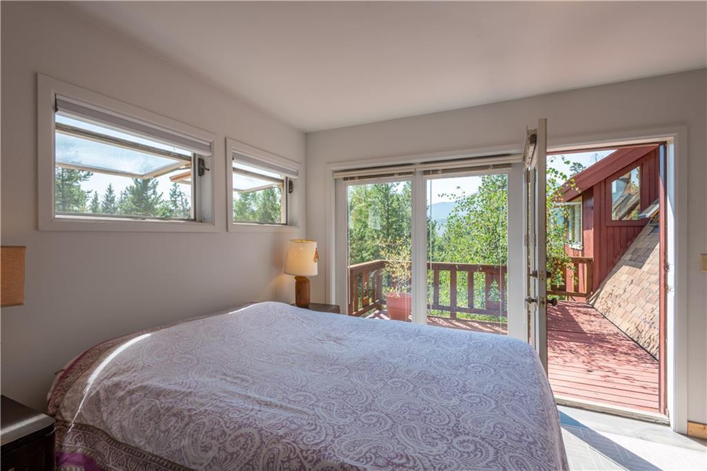 96 L Road Silverthorne, CO 80498 - Photo 33 of 35 a bedroom with a bed and a large window
