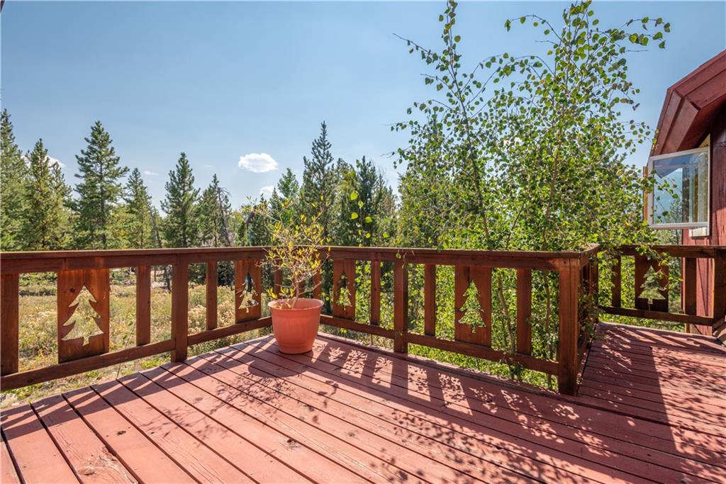 96 L Road Silverthorne, CO 80498 - Photo 9 of 35 a roof deck with wooden floor and fence