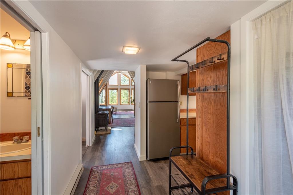96 L Road Silverthorne, CO 80498 - Photo 10 of 35 a view of a hallway with wooden floor and a bedroom