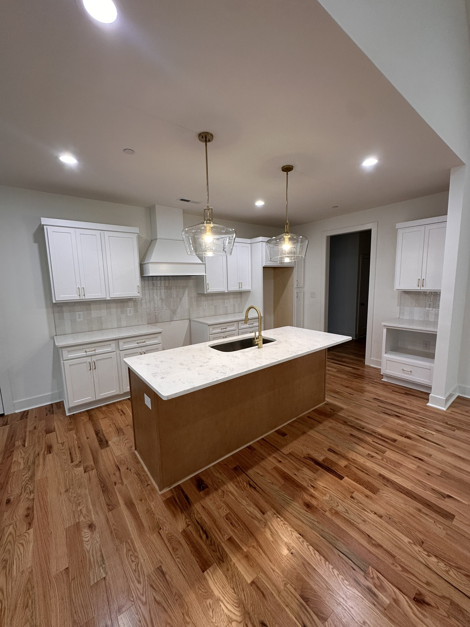 1324 Rooster Rdg Road Joelton, TN 37080 - Photo 4 of 15 a large kitchen with kitchen island a sink stainless steel appliances and white cabinets