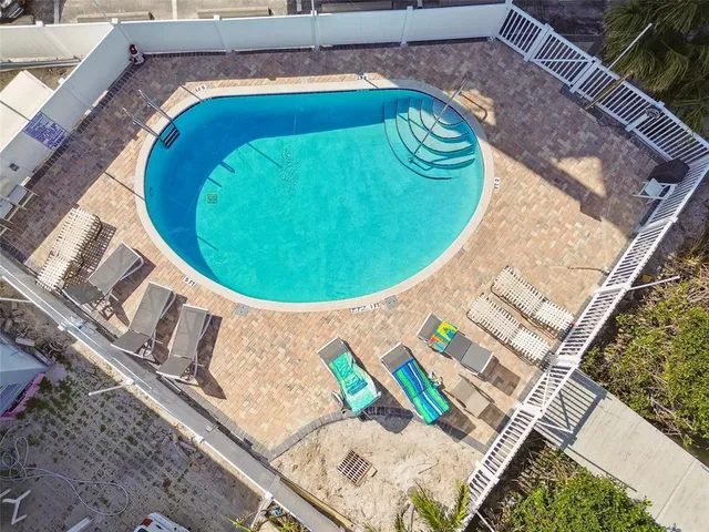 a living room with furniture a table and chairs