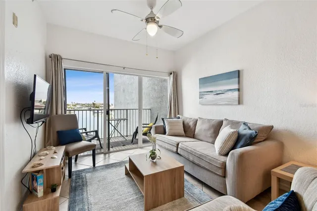 a bedroom with a bed and a tv