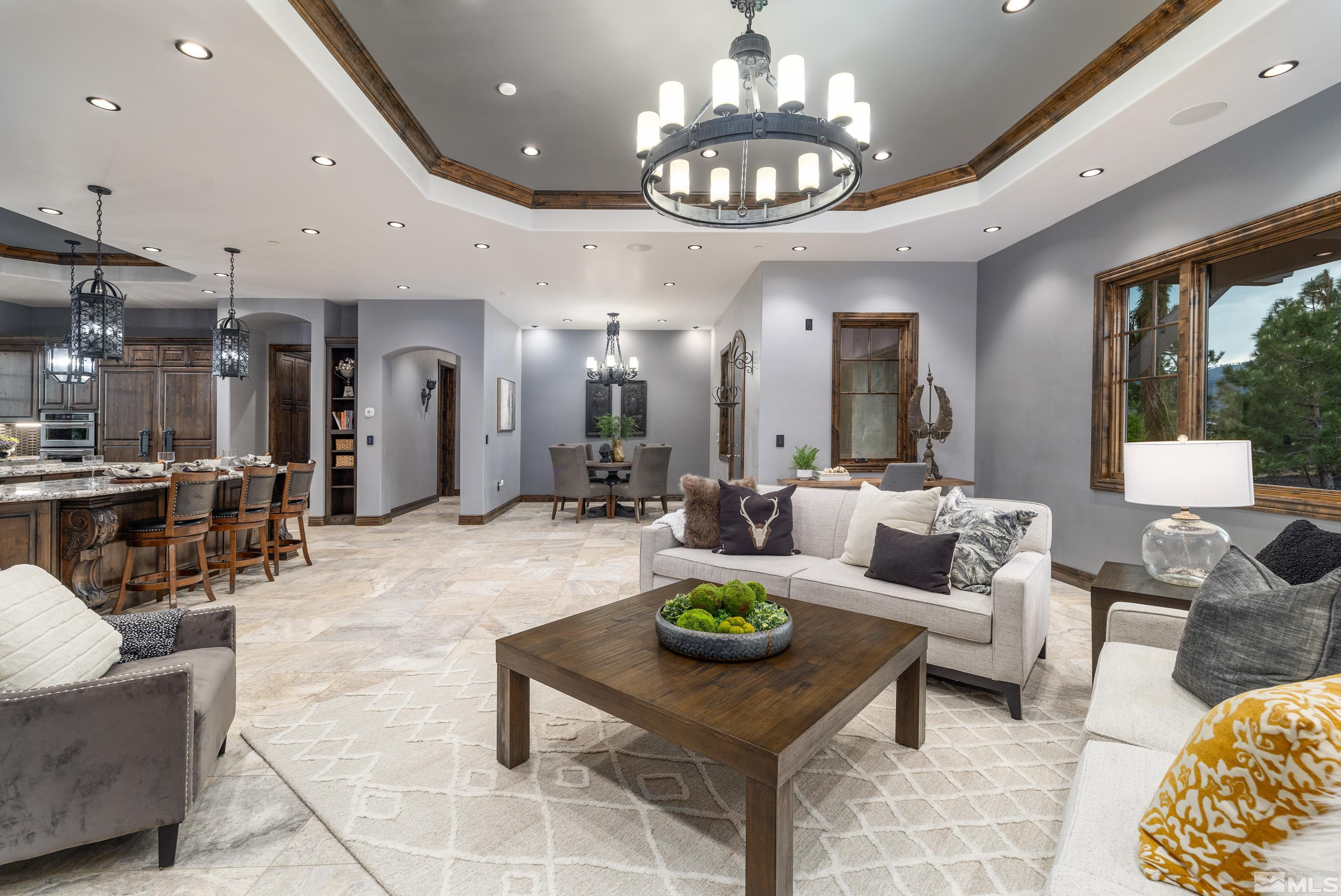 18250 Lake Vista Road Washoe Valley, NV 89704 - Photo 12 of 40 a living room with furniture and a chandelier