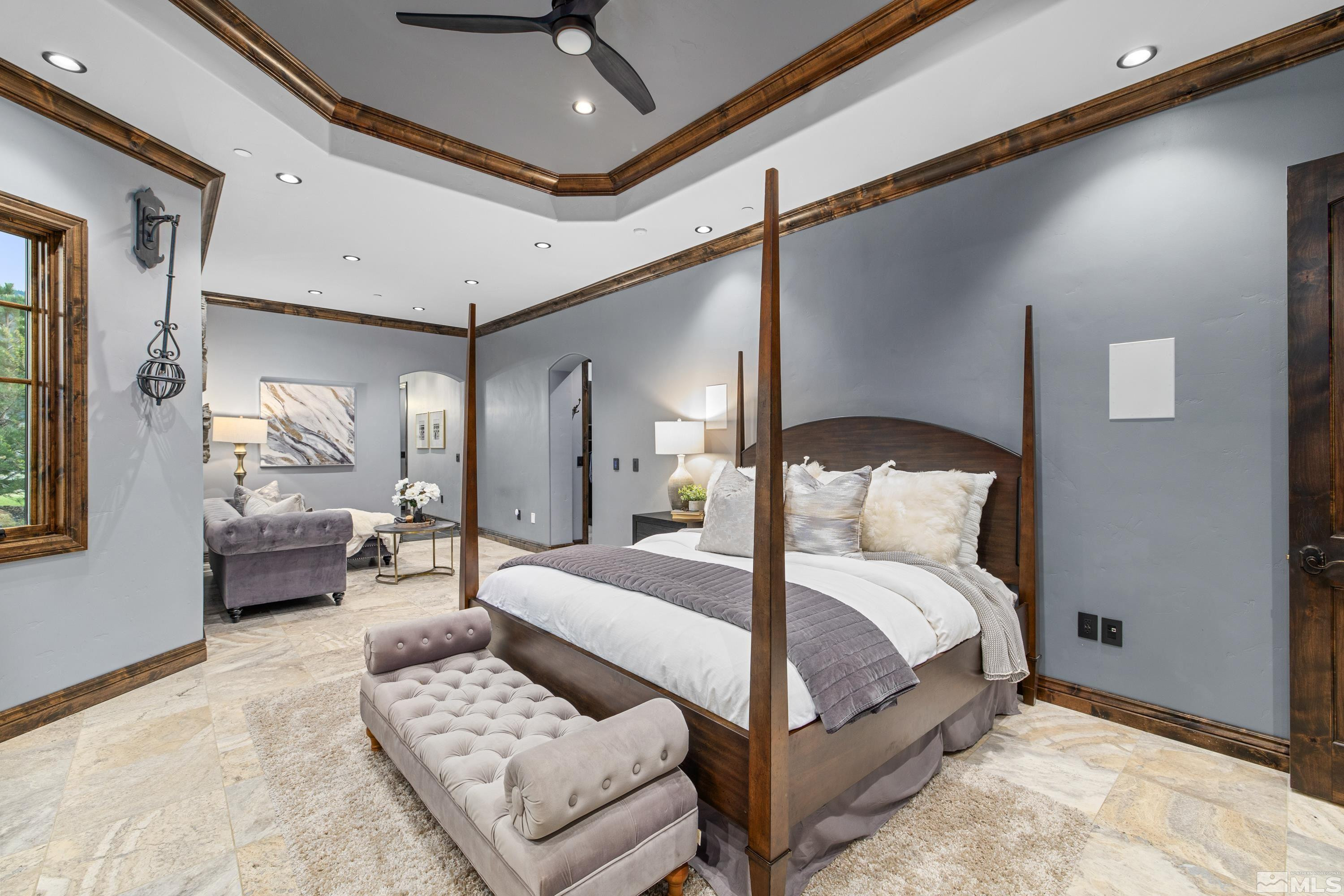 18250 Lake Vista Road Washoe Valley, NV 89704 - Photo 15 of 40 a bedroom with a large bed couch and a window