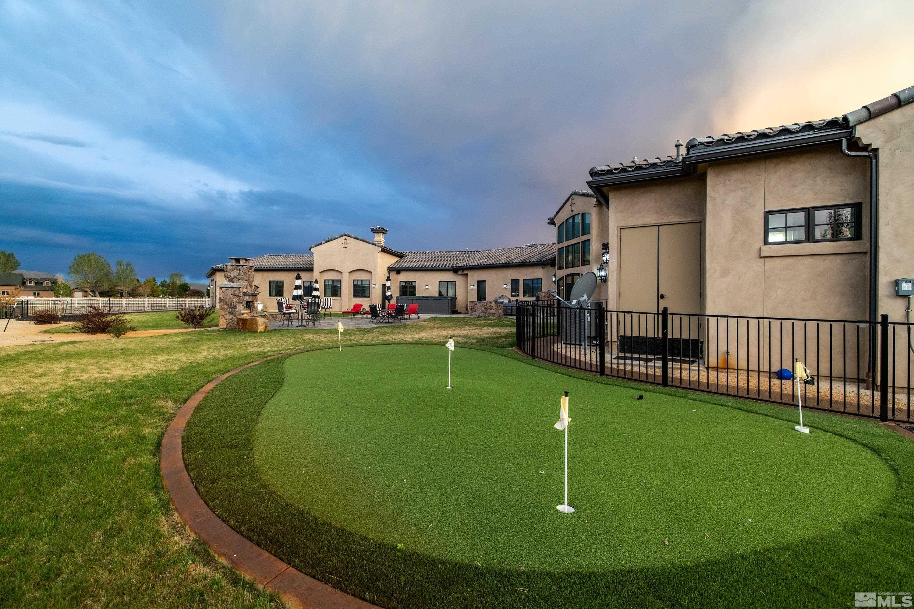 18250 Lake Vista Road Washoe Valley, NV 89704 - Photo 31 of 40 a view of a house with a swimming pool