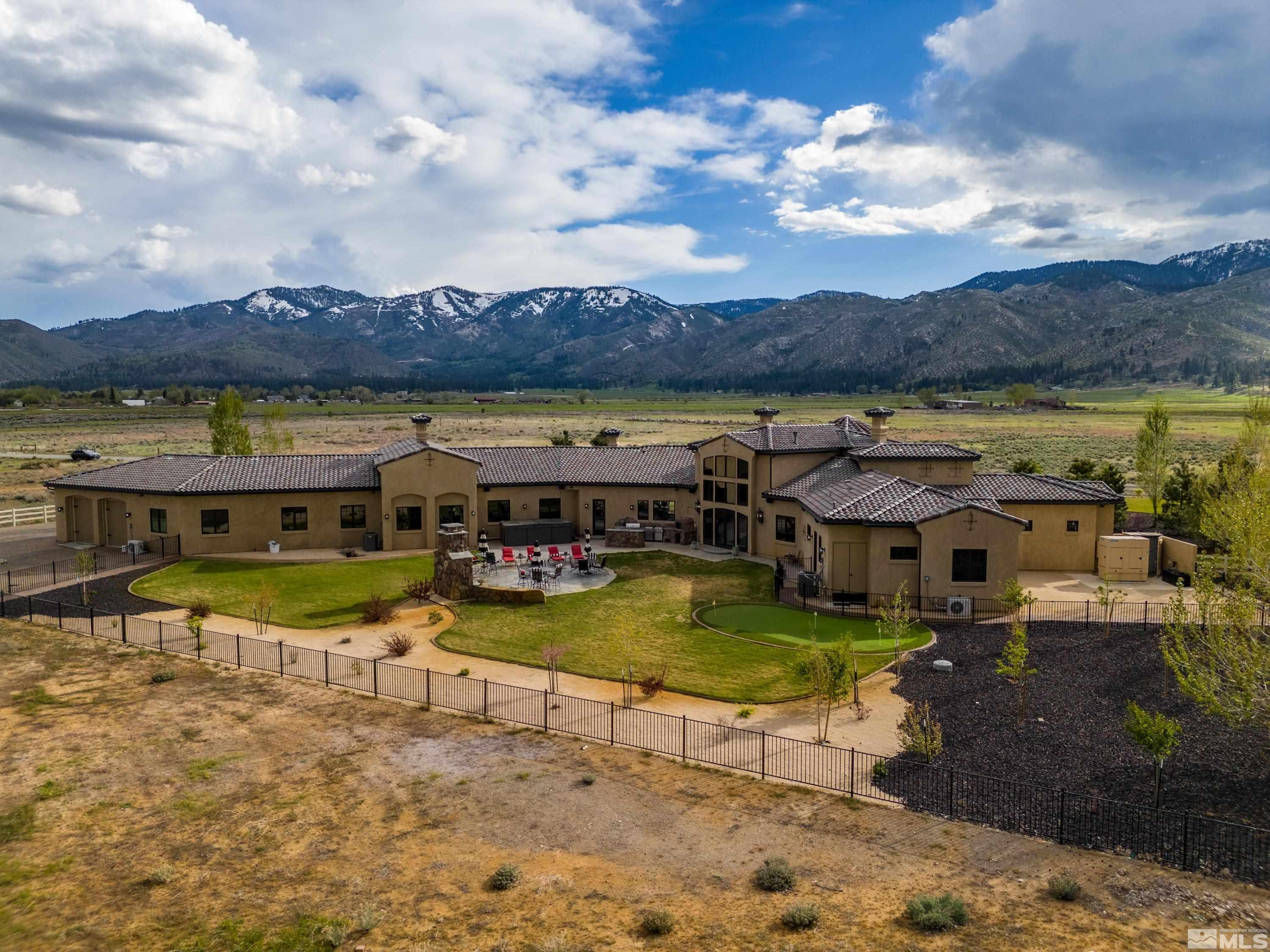 18250 Lake Vista Road Washoe Valley, NV 89704 - Photo 34 of 40 a view of a swimming pool with an outdoor seating and a yard
