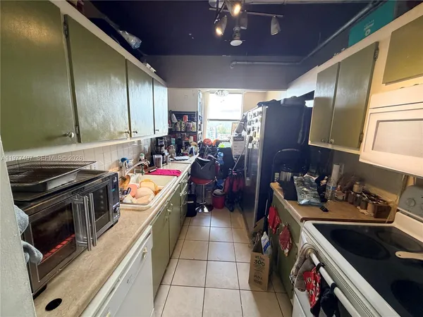 a kitchen with a stove and a sink