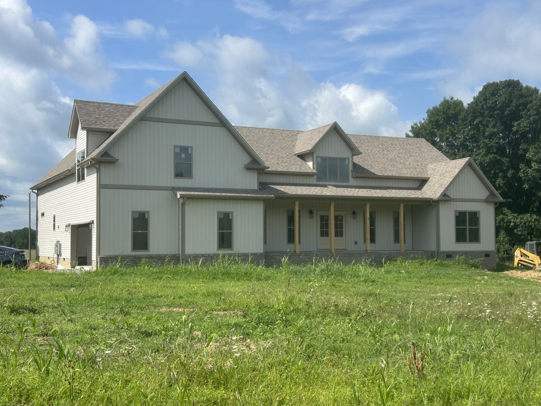 2330 South Hinton Road Southside, TN 37171 - Photo 1 of 17 a front view of a house with garden