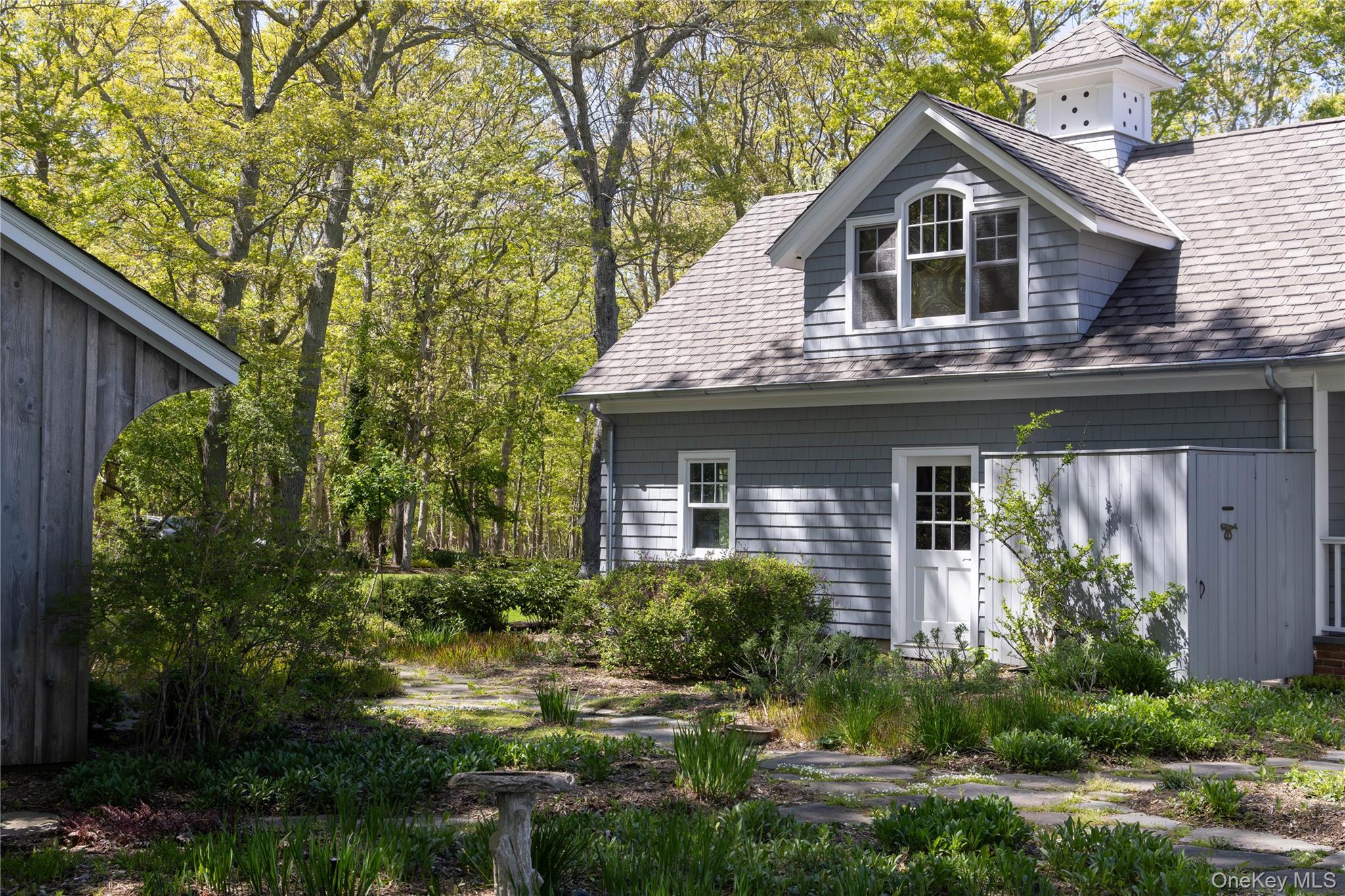 5055 New Suffolk Road New Suffolk, NY 11956 - Photo 32 of 42 a front view of a house with garden