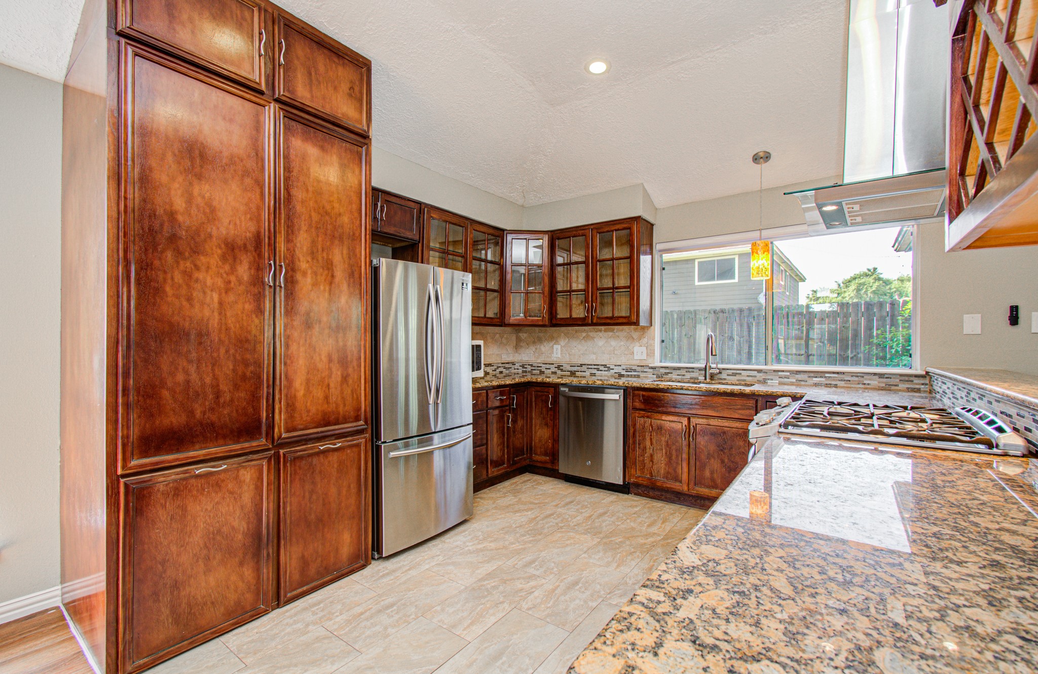 10546 Rippling Fields Drive Houston, TX 77064 - Photo 9 of 31 Abundance of cabinets offering plenty of storage with lots of natural lighting.