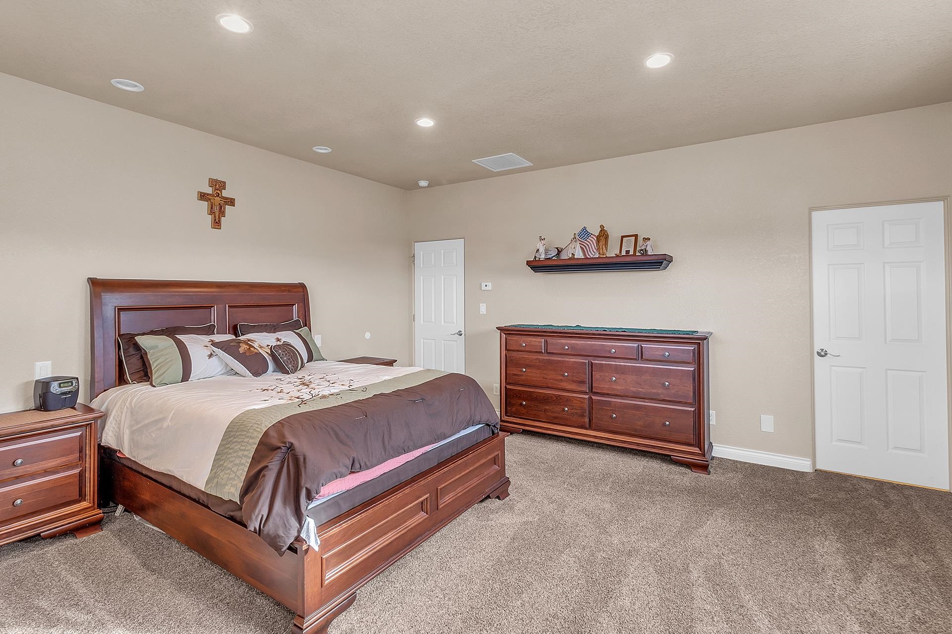 894 25 Road Grand Junction, CO 81505 - Photo 16 of 42 a bedroom with a bed and a ceiling fan