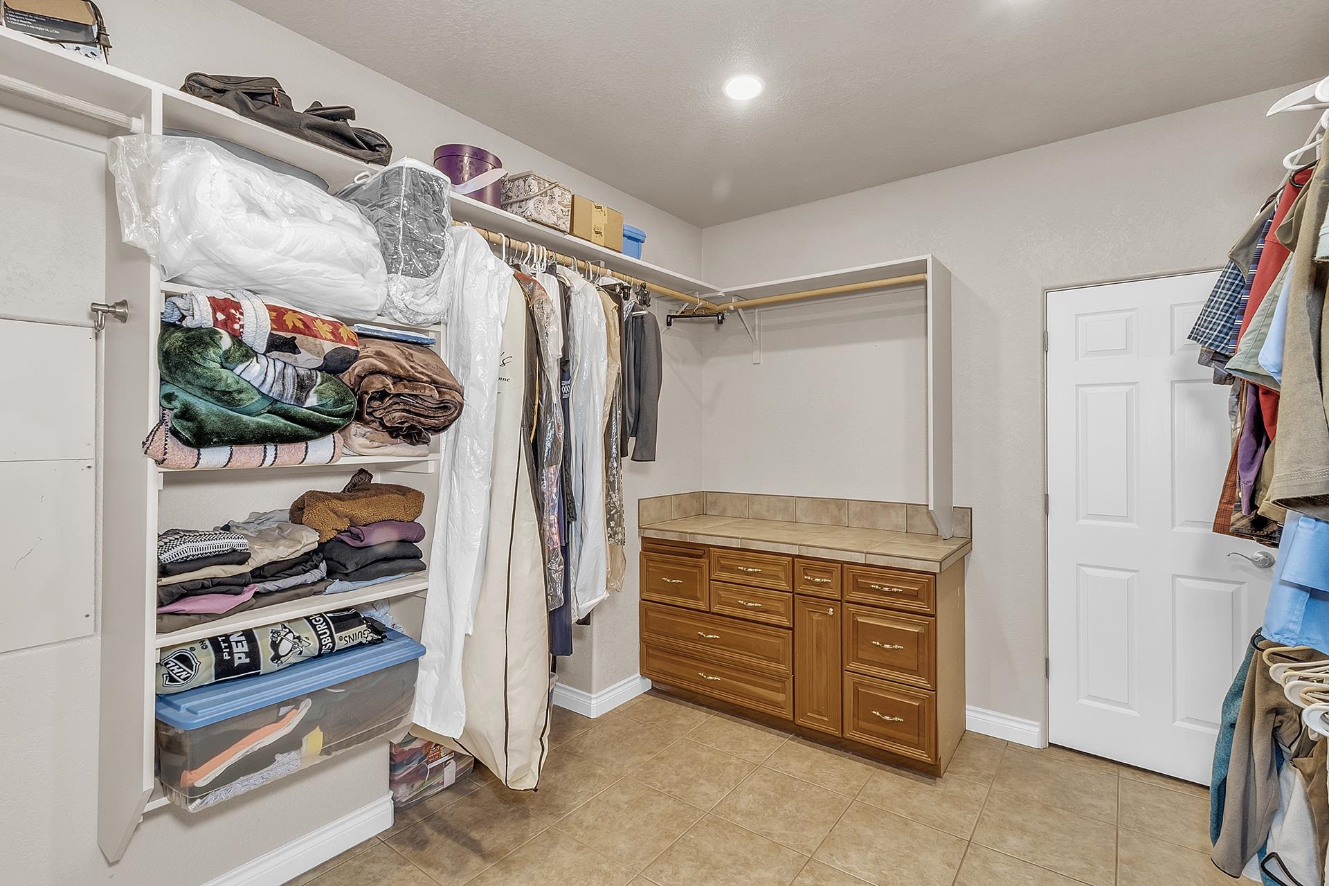 894 25 Road Grand Junction, CO 81505 - Photo 19 of 42 a view of walk in closet with clothes and shoes