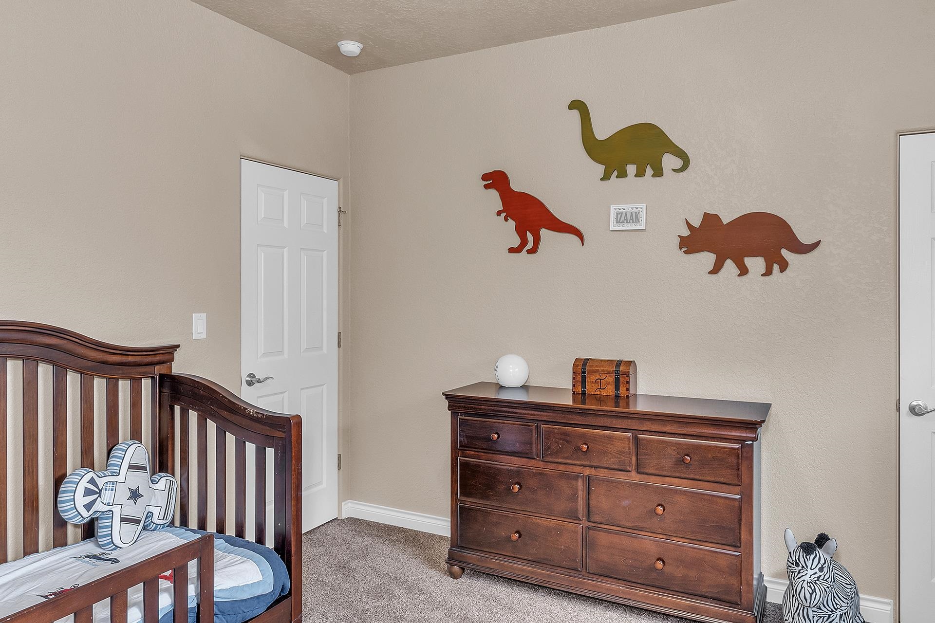 894 25 Road Grand Junction, CO 81505 - Photo 22 of 42 a bedroom with a baby bed baby crib and a dresser