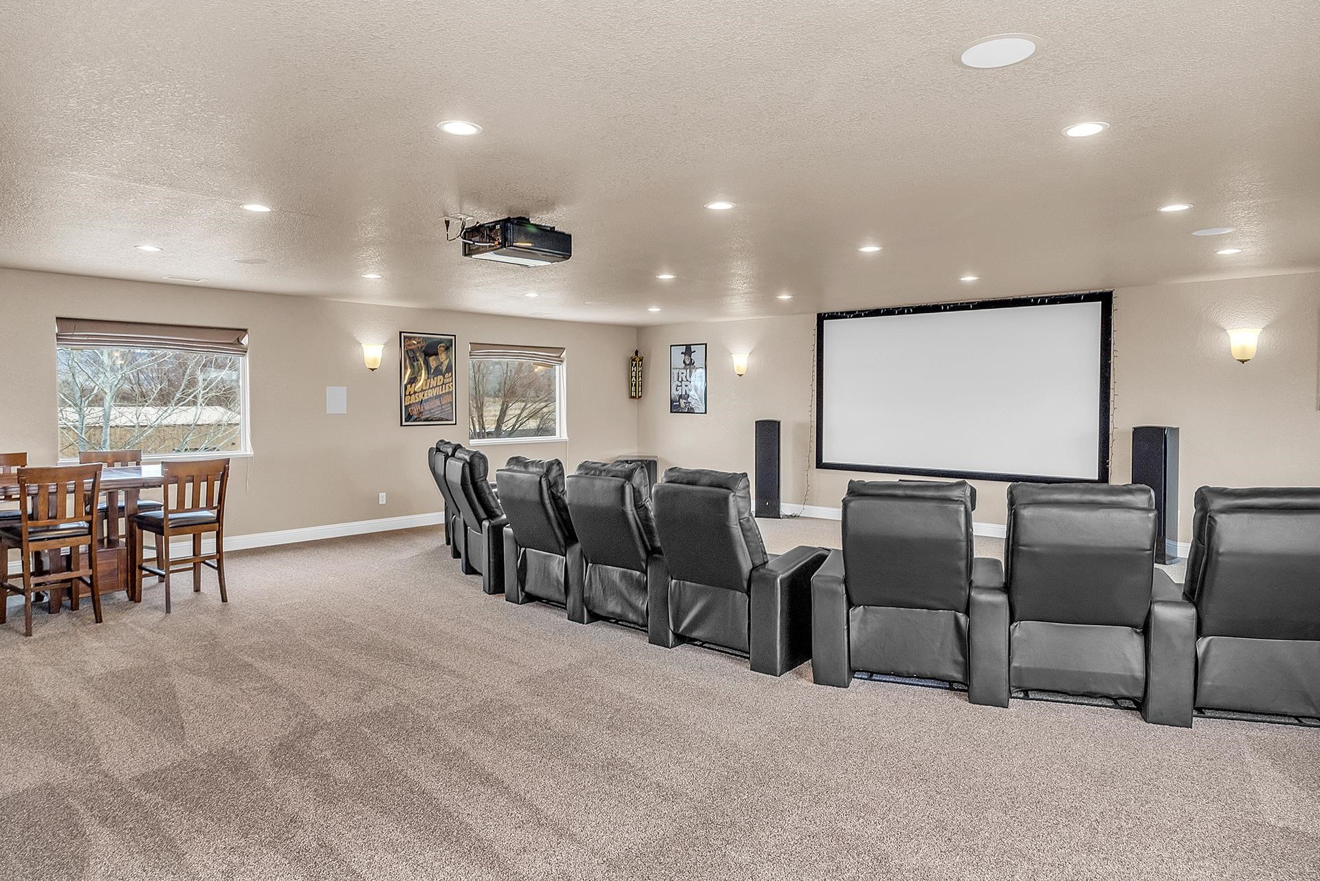 894 25 Road Grand Junction, CO 81505 - Photo 24 of 42 a living room with lots of chairs and projector