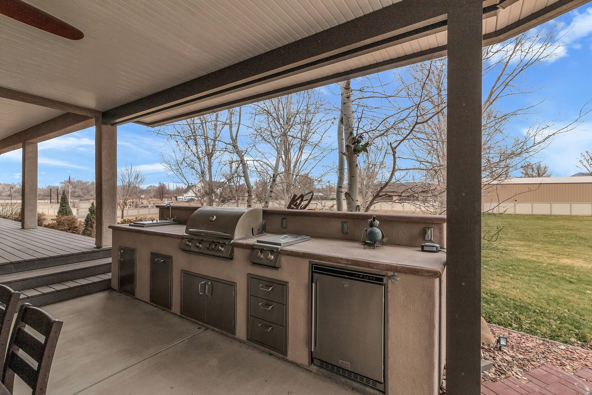 894 25 Road Grand Junction, CO 81505 - Photo 7 of 42 a kitchen that has a sink and large window