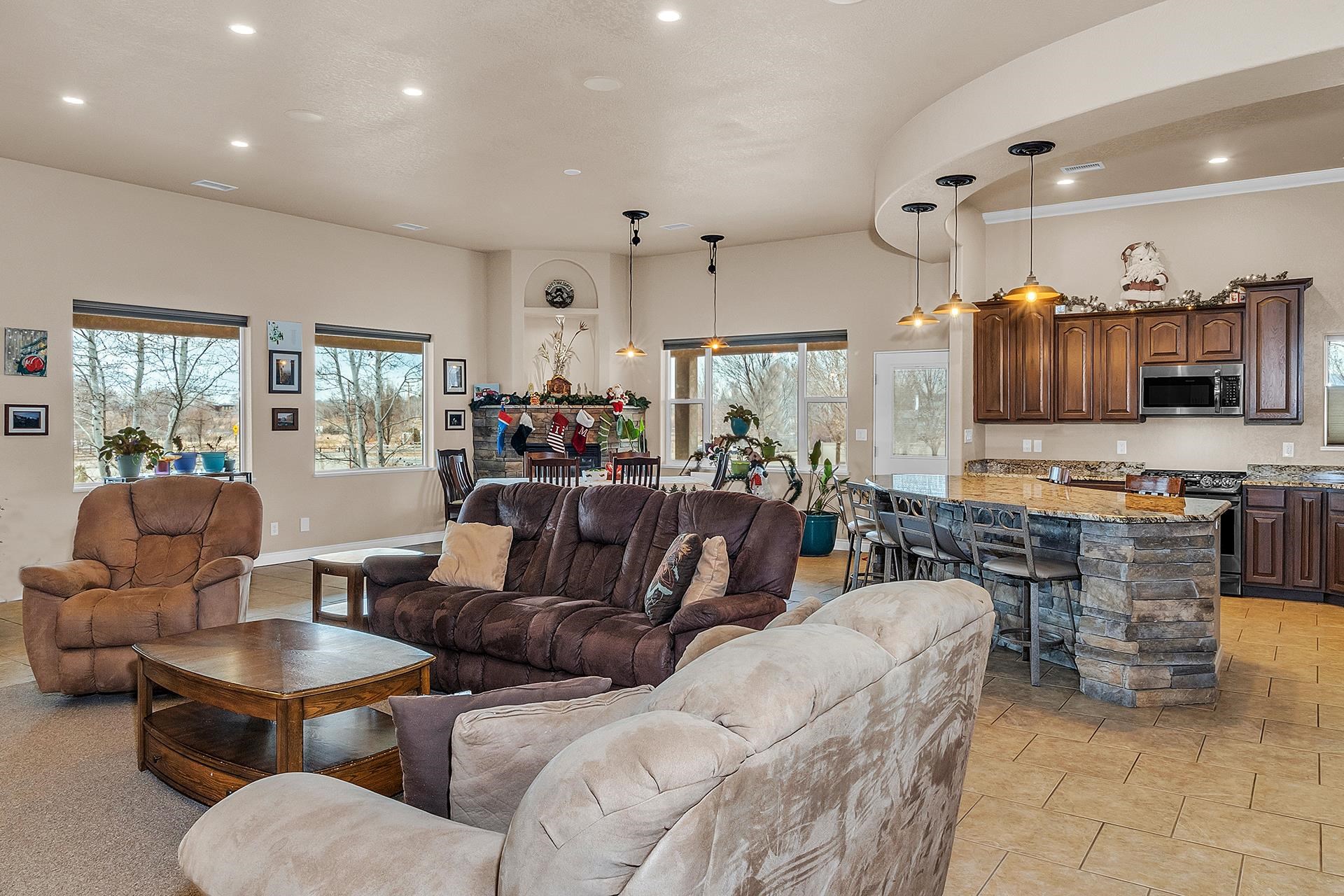 894 25 Road Grand Junction, CO 81505 - Photo 9 of 42 a living room with lots of furniture and kitchen view