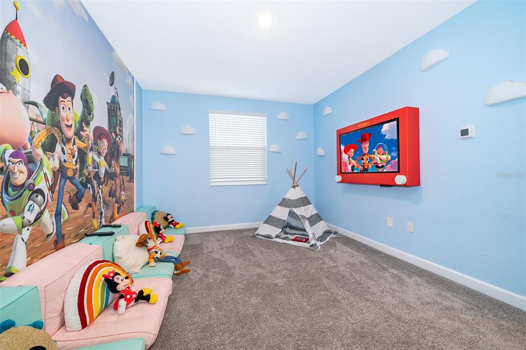 830 Sticks Street Davenport, FL 33896 - Photo 20 of 37 a room with toys and wall paintings