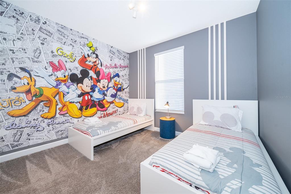 830 Sticks Street Davenport, FL 33896 - Photo 8 of 37 a bedroom with bed and a window