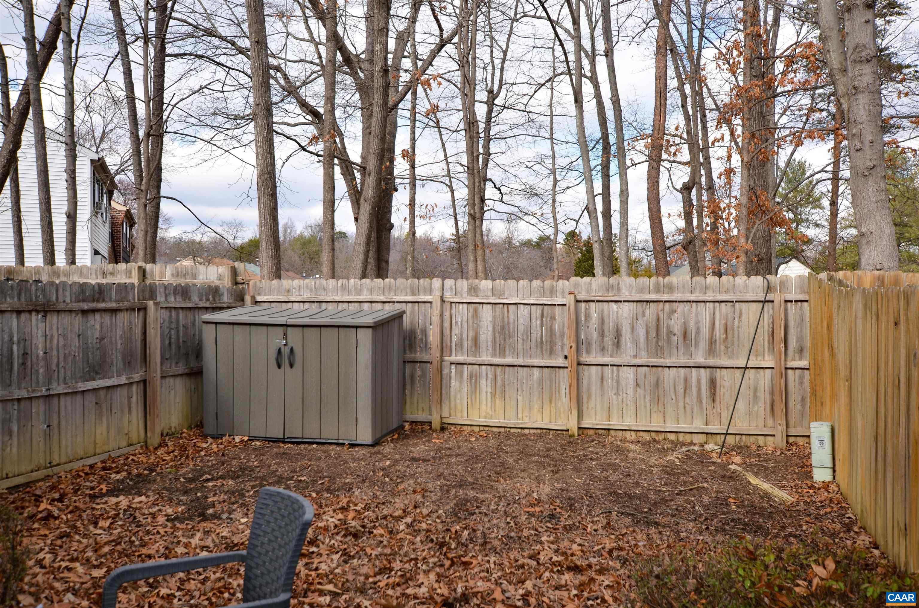 1594 Cool Spring Road Charlottesville, VA 22901 - Photo 12 of 26 a view of a backyard with large trees and wooden fence