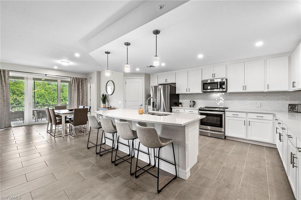 172 Indies Drive East, Unit 101 Naples, FL 34114 - Photo 12 of 33 Kitchen/Dining Area
