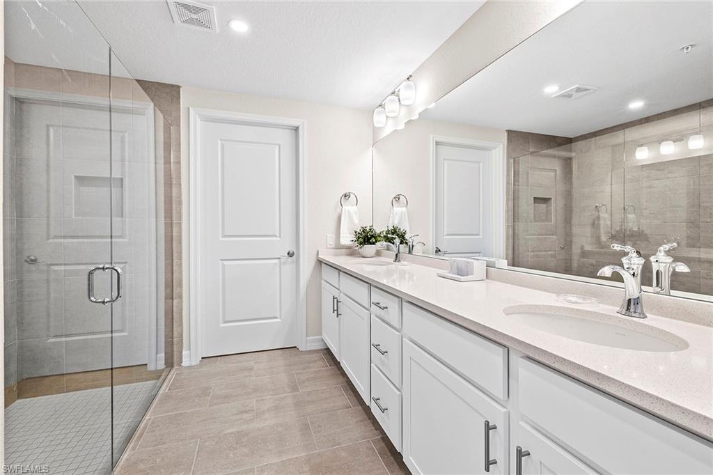 172 Indies Drive East, Unit 101 Naples, FL 34114 - Photo 16 of 33 Master Bathroom
